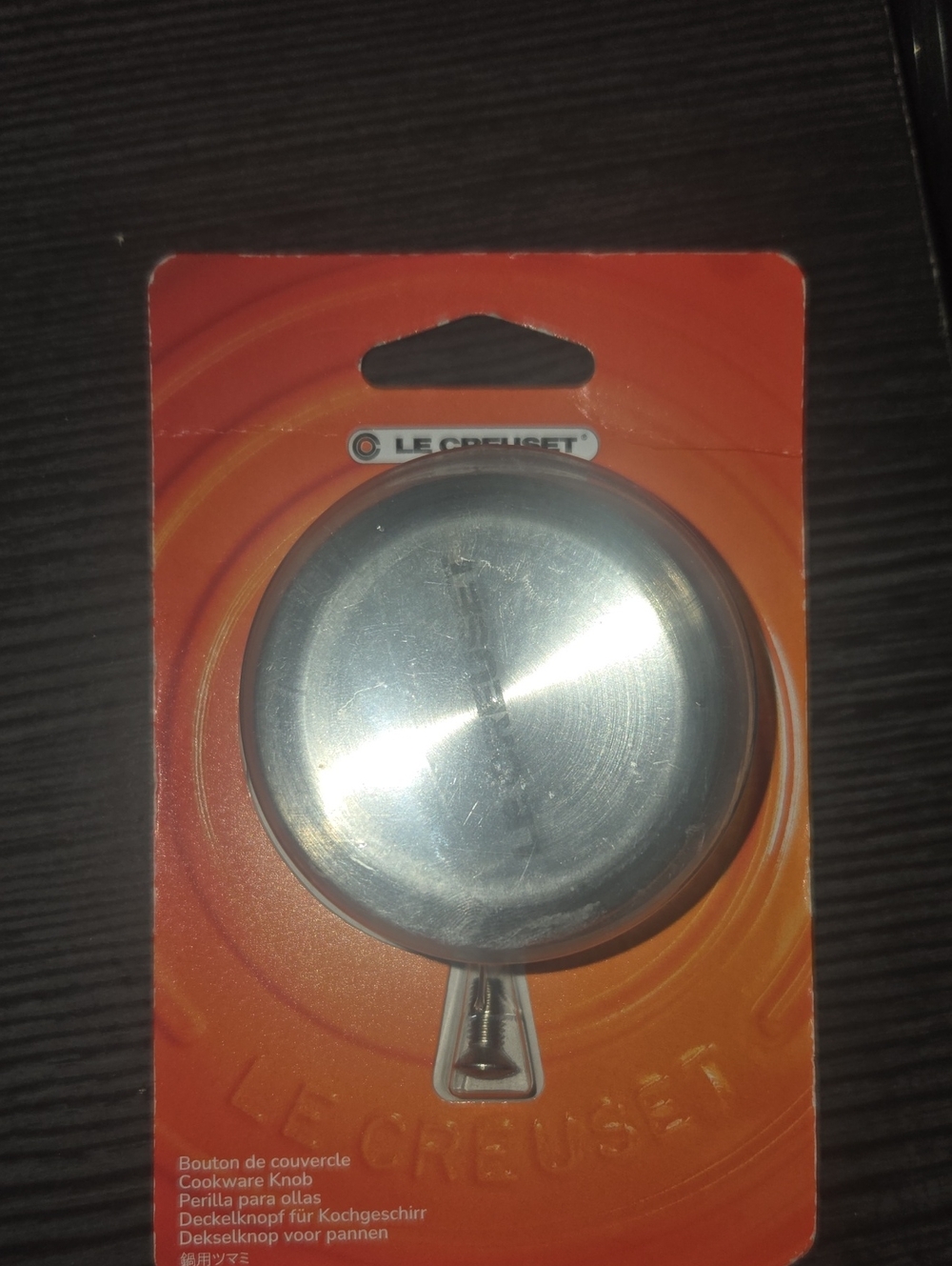 Le Creuset Stainless Steel Replacement Cookware Knob on Orange Card